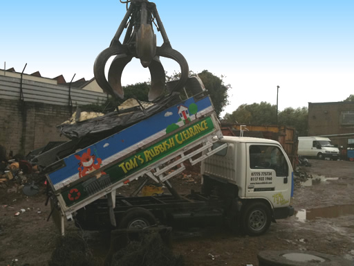 toms tipper truck delivery scrap metal to a yard